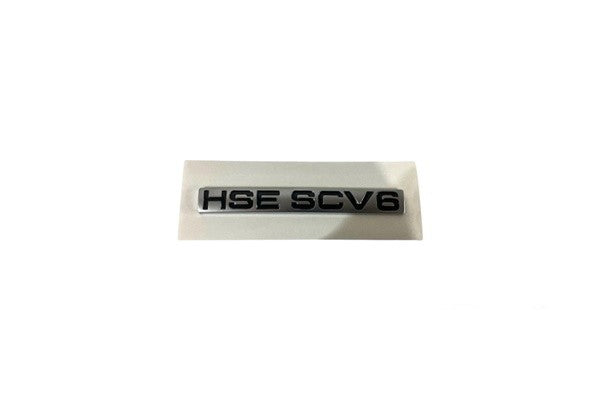 Rear Tailgate Emblem Hse Scv6  with reference OE replacement number HSESCV6. Accessories catalog part. Land Rover fitment: Range Rover Sport L320 (2005-2009), models.